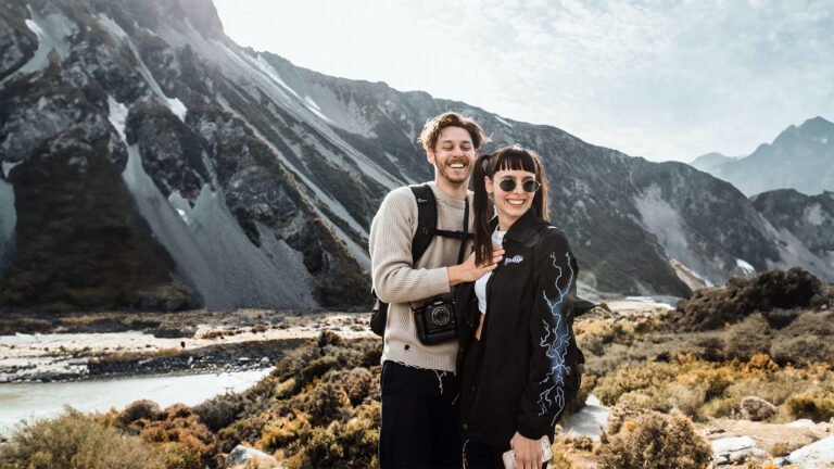 young couple on a group tour of new zealand 768x432