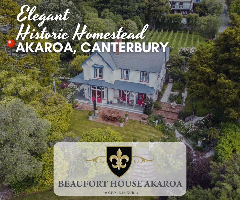 Aerial view of Beaufort House Akaroa, a luxury historic homestead surrounded by lush gardens in Akaroa, Canterbury – boutique bed and breakfast accommodation with vineyard, heritage charm, and harbour views.