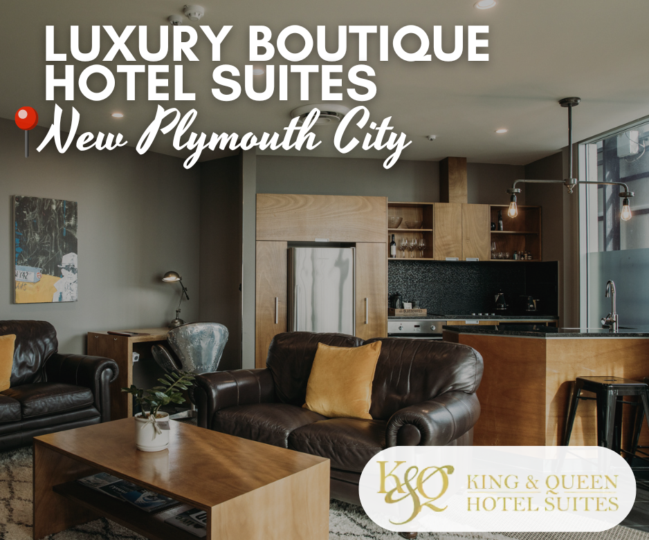 Modern luxury hotel suite with leather couches, wooden furnishings, and open-plan kitchen at King & Queen Hotel Suites. Text overlay reads ‘Luxury Boutique Hotel Suites – New Plymouth City.’ Logo in bottom right