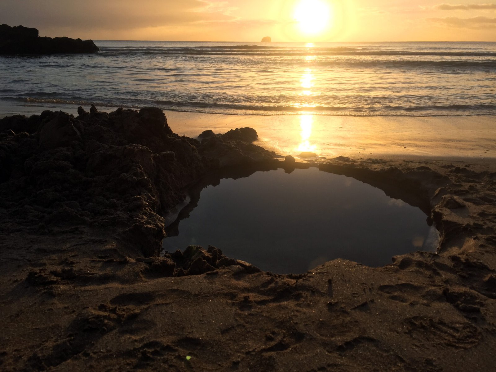 Dig a hole at Hot Water Beach, Coromandel, New Zealand for your own free geothermal pool