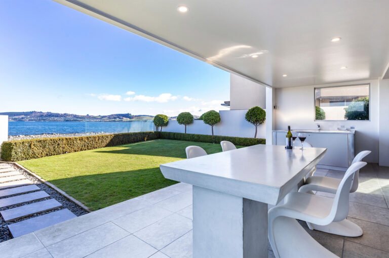 Balcony dining with mountain views at Sacred Waters Apartments 768x510