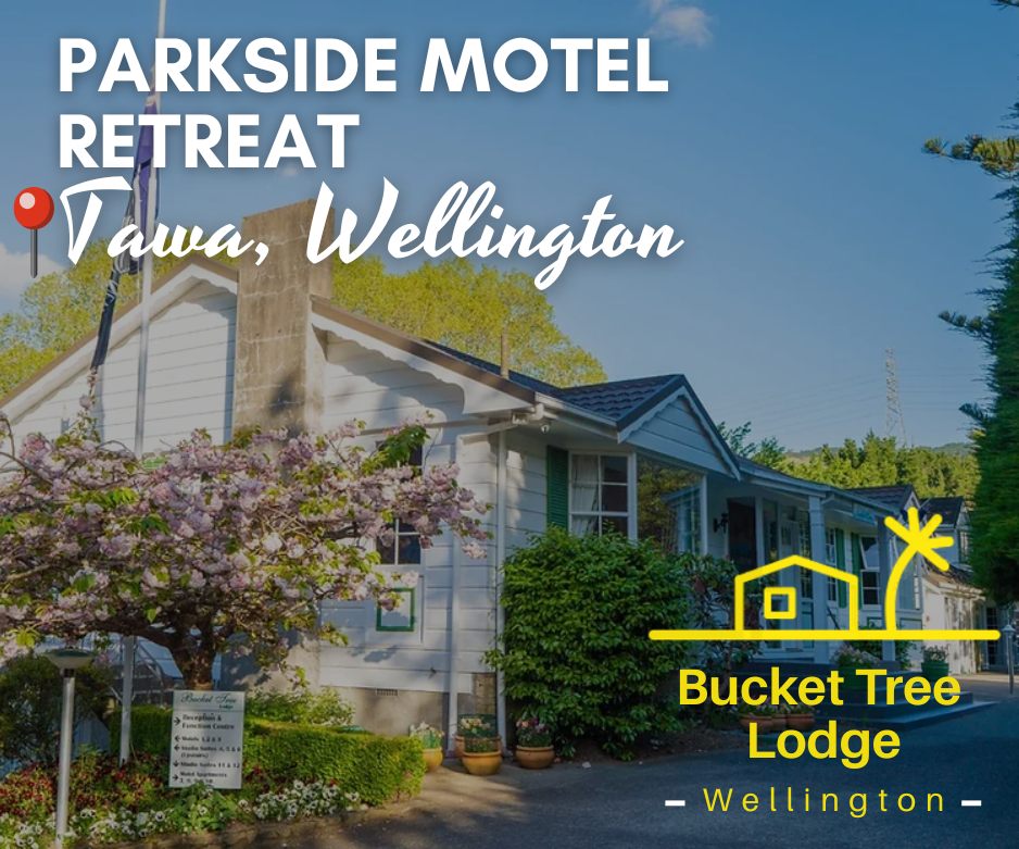 Exterior of Bucket Tree Lodge, Tawa’s only garden motel in Wellington, surrounded by lush greenery and flowering trees beside Willowbank Reserve. The spacious park-like setting offers family-friendly self-contained units ideal for short or extended stays, with easy access to Wellington city, Porirua, and local cafes.