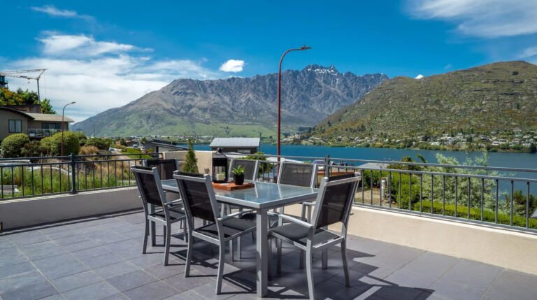 balcony overlooking lake at element escapes accommodation queenstown 768x429