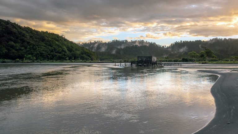 okarito wharf lagoon sunset west coast 768x432