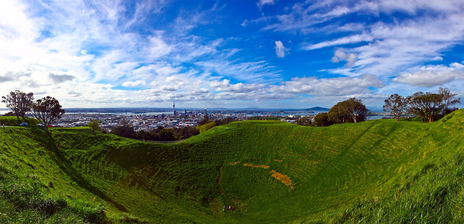 Mount Eden crater with panoramic views of Auckland skyline and harbour