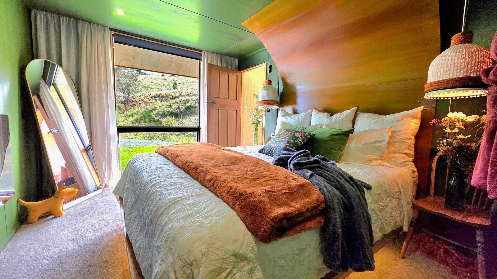 luxury cabin bedroom at ripples retreat near waitomo