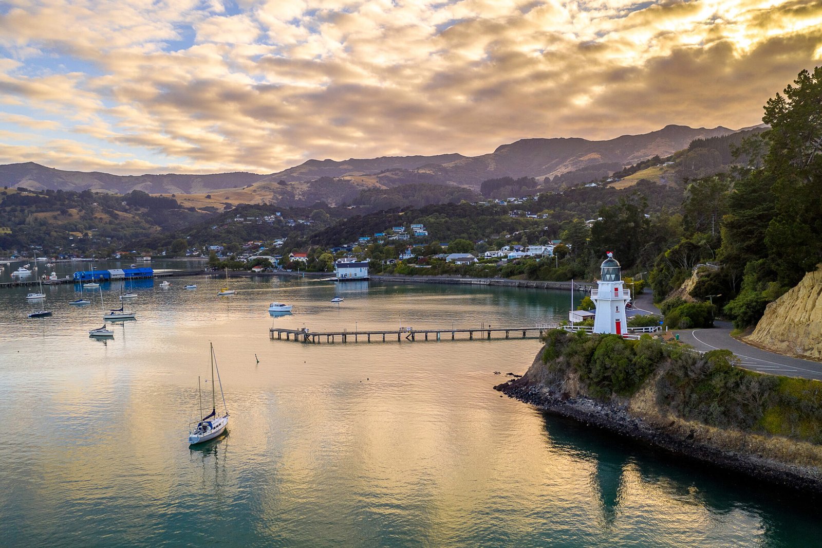 Akaroa harbour lighthouse and Banks Peninsula coastline Canterbury NZ