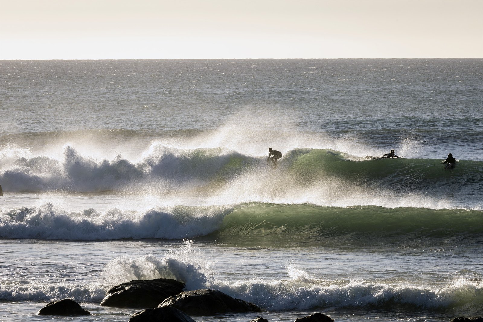 Surfing waves Taranaki west coast New Zealand
