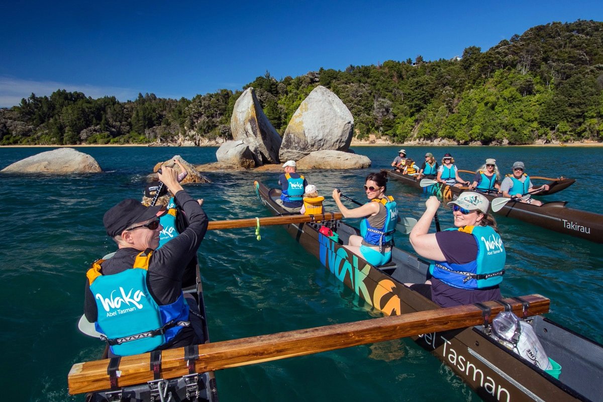Waka tours in Abel Tasman National Park with group paddling near Split Apple Rock