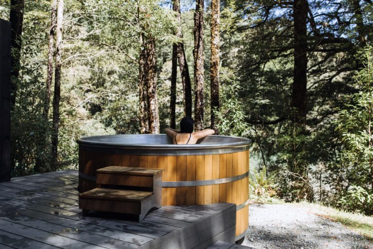 maruia river retreat forest hot tub wellness retreat new zealand 768x512