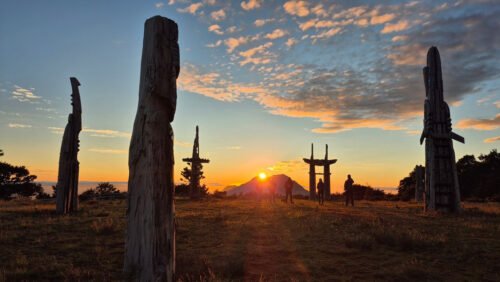 Māori carvings at sunrise on sacred Maunga Hikurangi, one of New Zealand's most iconic Māori cultural experiences