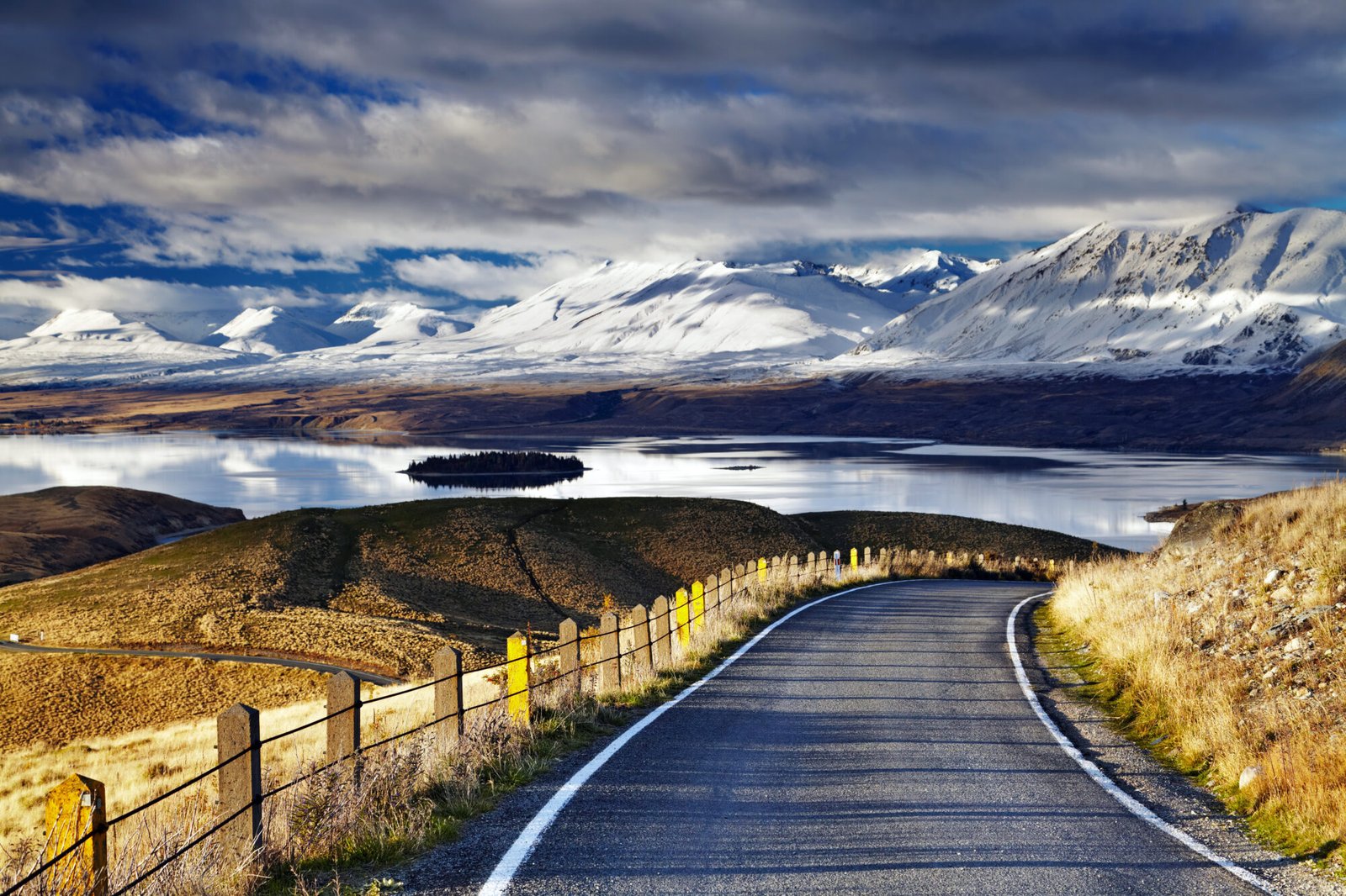 Scenic drive beside Lake Pukaki with snow-covered Southern Alps