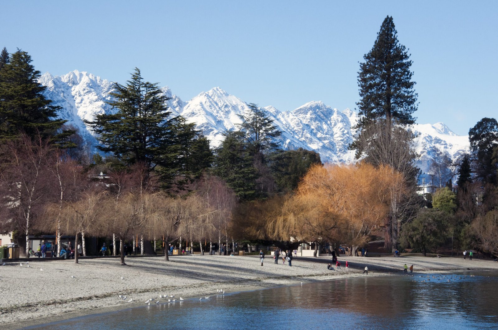 Queenstown lakefront with snow-covered Remarkables during a South Island winter road trip