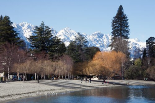 Queenstown lakefront with snow-covered Remarkables during a South Island winter road trip